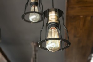 Vintage interior lighting lamp in coffee shop.